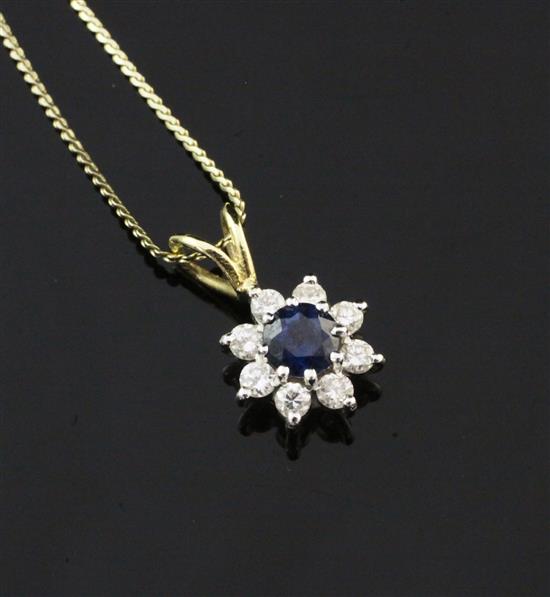 An 18ct gold, sapphire and diamond cluster pendant of flower head design, on a 14ct gold fine link chain, 0.5in inc. bale.